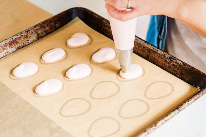Piping the macaron egg cookies